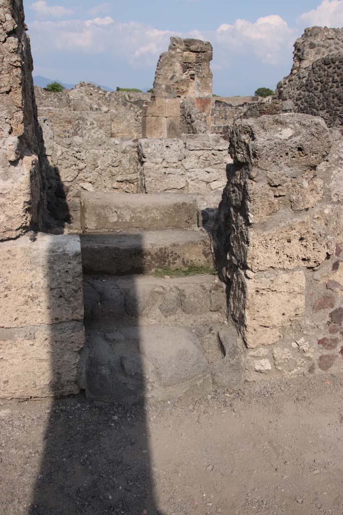 VIII.4.15 Pompeii. September 2021. 
Steps to upper floor on east side of portico. Photo courtesy of Klaus Heese.
