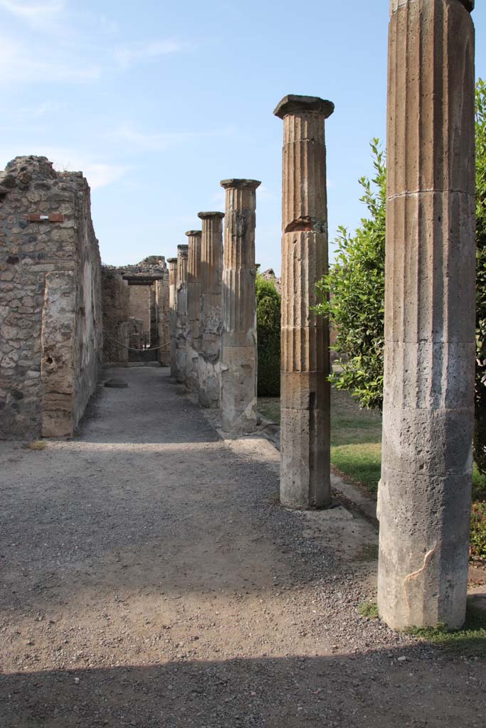 VIII.4.15 Pompeii. September 2021. 
Looking north along west portico, with doorway to exedra 17, on left. Photo courtesy of Klaus Heese.