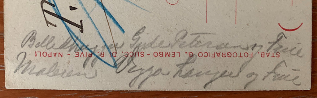 Note on the side of the front of the 1899 postcard which appears to identify the people in the drawing.
The phrase on the left-hand side of the address side “Billedhugger Gyde Petersen og Frue” translates as “The sculptor Gyde Petersen and wife”.
Hans Gyde-Petersen was baptised 26th December 1862 as Hans Gyde Pedersen but later changed his name to Hans Gyde-Petersen.
His sculpture won him a grant to study in Italy from 1897 to 1899. 
During these years in Italy, he turned his back on a promising career as a sculptor and returned to his first love of landscape painting.
He was part of the Skagen artists group on the northern tip of Denmark.
He was knighted by the Danish King in 1910. 
He died in Denmark in 1943.
Underneath is what looks like: "Maleren Viggo Langer og Frue” (the painter Viggo Langer and wife). 
Viggo Langer was a Danish artist. 
Born Viggo Hansen on Nov. 11th 1860 in Reudnitz (by Leipzig, Germany), died Oct.11 1942 in Rungsted, Denmark.
His father was Danish and moved the family back to Copenhagen in 1864.
He adopted his mother's family name Langer in 1885 to avoid confusion with another painter, an artist known as Viggo Hansen.
At auction on October 2, 1998 was a signed painting of his titled “Aftenstemning ved Pompeij (Evening scene in Pompeii)” on which are the words "Pompeij 1899", which would seem to confirm his presence at the time of this postcard.
Who drew the sketch is not known but possibly it was another Danish artist who was in Italy in 1899?