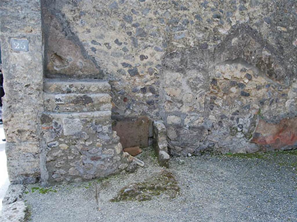 VIII.4.25 Pompeii. May 2014. Remains of counter with stepped shelves against south wall. Photo courtesy of Paula Lock.