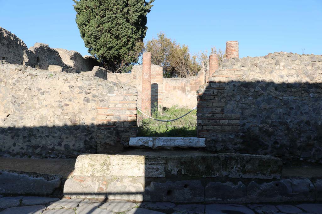 VIII.4.34 Pompeii. December 2018. 
Looking north to entrance doorway on a raised ramp in pavement. Photo courtesy of Aude Durand.