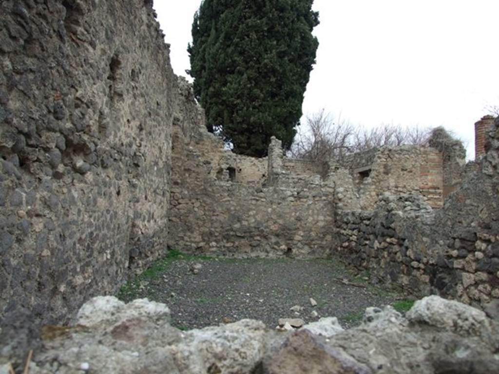 VIII.4.34 Pompeii. December 2007. Workshop room on west side of atrium, looking north.
According to Eschebach, at the rear of the workshop was the kitchen and latrine, and steps to the upper floor of which 15 steps were remaining. Underneath the steps was a cupboard/small room.
See Eschebach, L., 1993. Gebäudeverzeichnis und Stadtplan der antiken Stadt Pompeji. Köln: Böhlau, (p.376).
According to Bragantini, et al, against the west wall of the kitchen stood the masonry bench/podium with storage below. At the side of the bench was a wall, separating the bench from the latrine.
See Bragantini, de Vos, Badoni, 1986. Pitture e Pavimenti di Pompei, Parte 3. Rome: ICCD, (p.345).