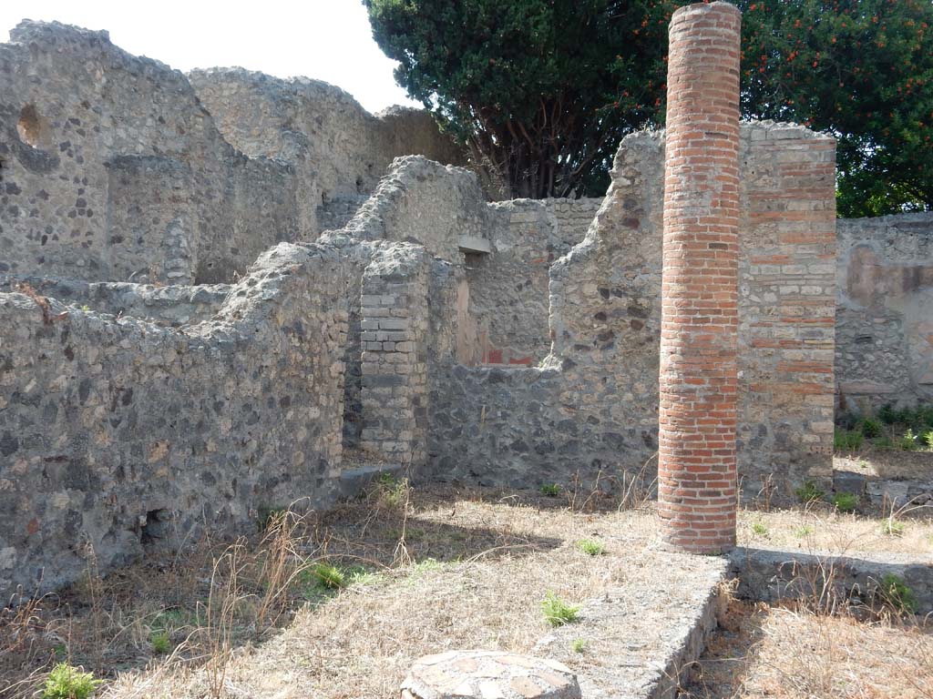 VIII.4.34 Pompeii, June 2019. West wall of atrium, with doorway, centre, leading to kitchen and latrine. 
Photo courtesy of Buzz Ferebee.
