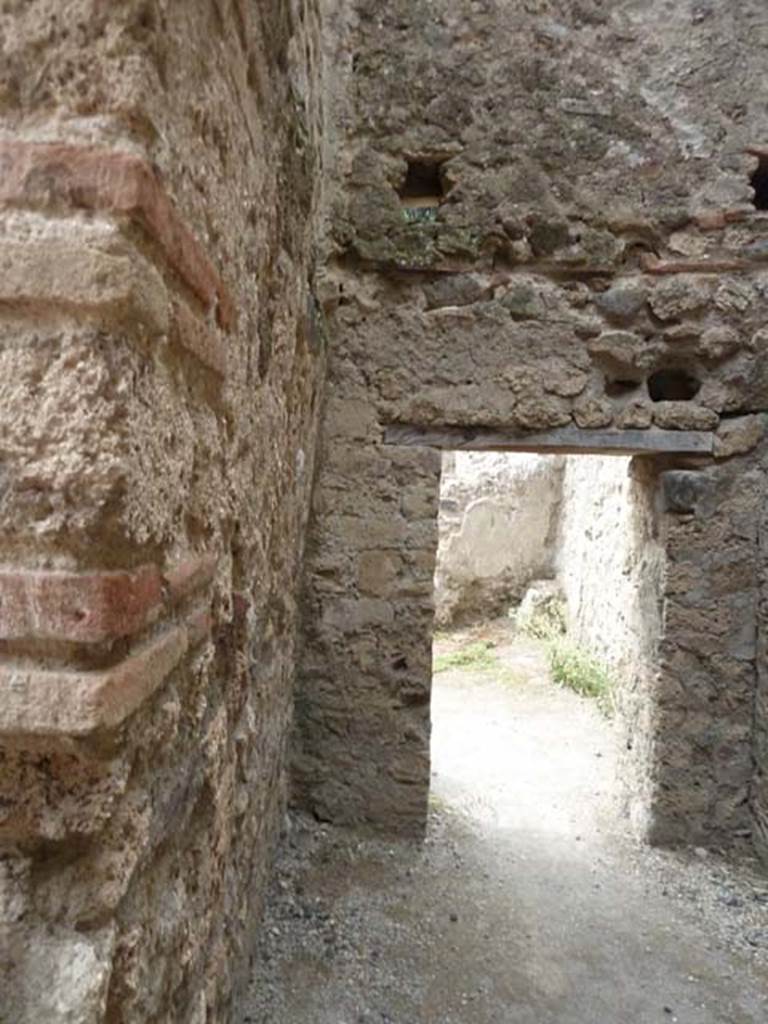 VIII.4.44 Pompeii. September 2015. Looking west towards doorway to room behind triclinium.