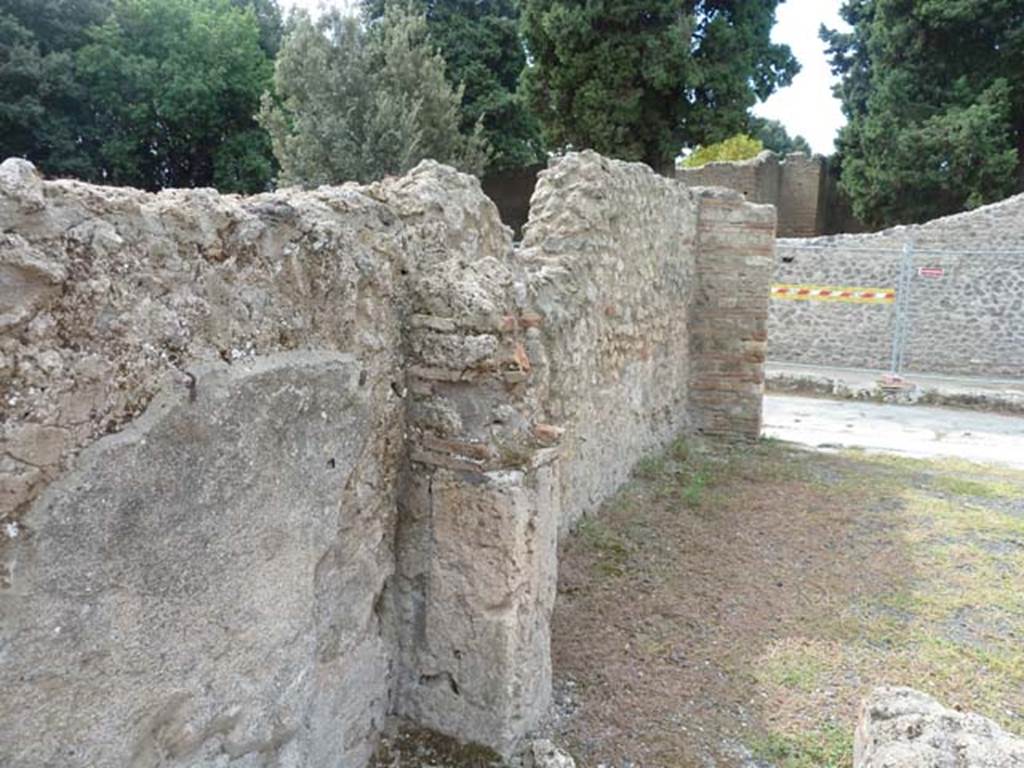 VIII.4.45 Pompeii. September 2015. Looking west along south wall of shop-room.