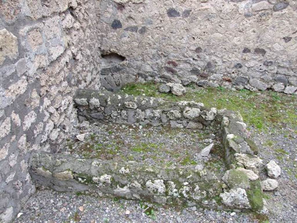 VIII.4.48 Pompeii. December 2007. Looking south to remains of vat or tub, and latrine in south-east corner of shop.