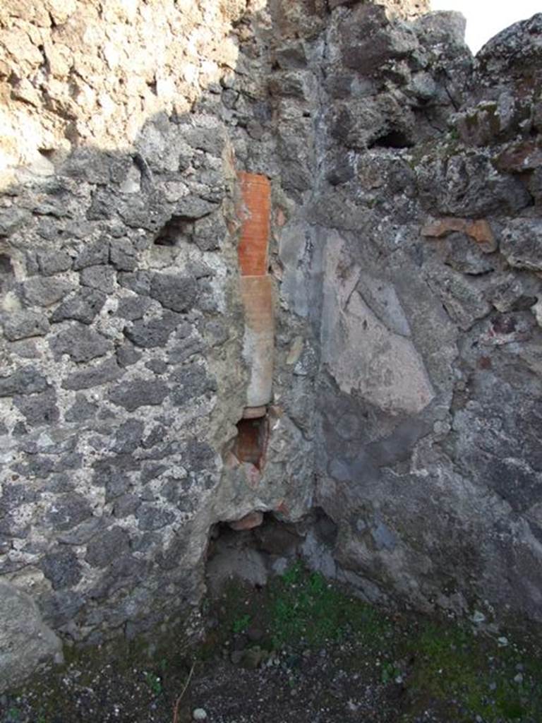VIII.5.3 Pompeii. December 2007.  South-east corner of shop, with waste pipe from upper floor.