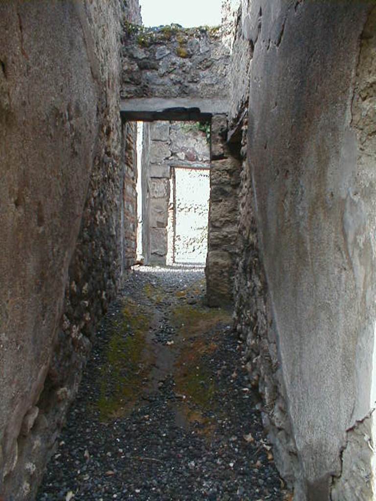 VIII.5.13 Pompeii. December 2006. Looking west to site of steps to upper floor. The line of the stairs can be seen in the plaster on both side walls