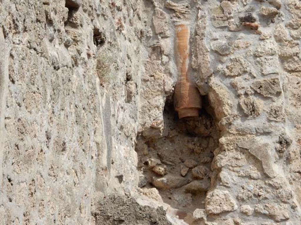 VIII.5.15 Pompeii. May 2017. Room 1, downpipe in north wall above stairs. Photo courtesy of Buzz Ferebee.