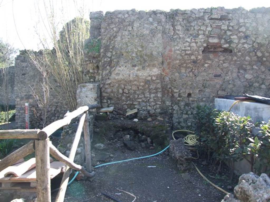 VIII.5.15 Pompeii. March 2009. Room 3, south side of remains of kitchen, with hearth.