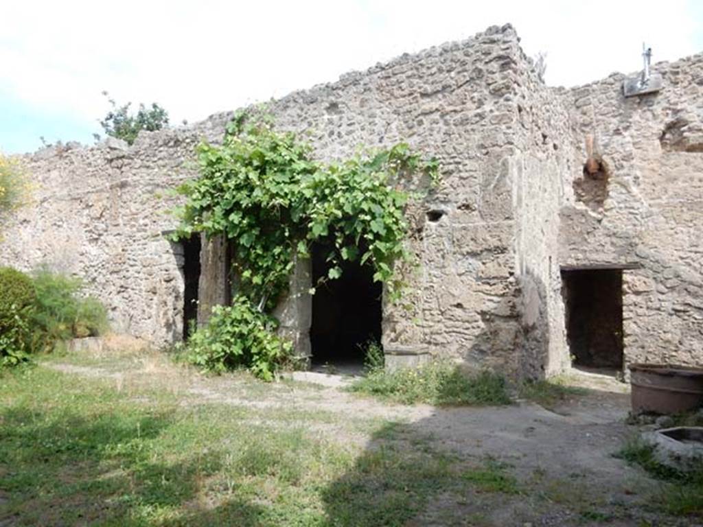 VIII.5.15 Pompeii. May 2017. Room 2, looking towards doorways in north wall. 
The small room under the stairs in room 1 can be seen on the right. 
Room 8 a cubiculum is the doorway on the left, the doorway into room 9 which was another cubiculum is in the centre.  
Photo courtesy of Buzz Ferebee.