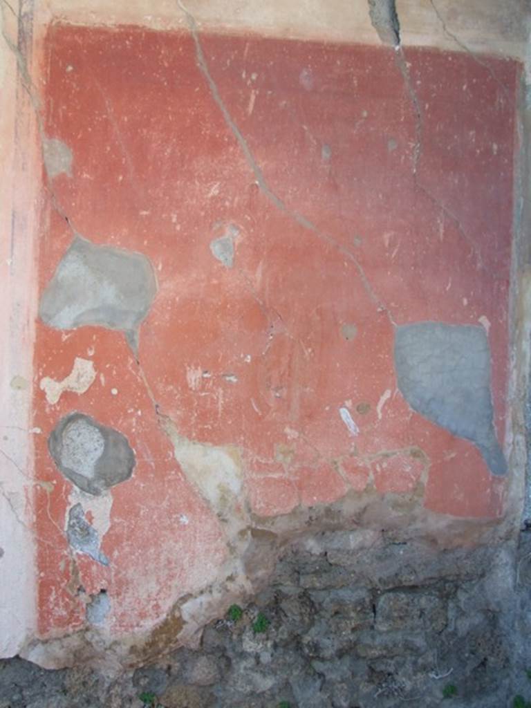 VIII.5.15 Pompeii. March 2009. Room 2, west wall, detail of painted panel. On the same wall, in the red panel on the right, traces of a male figure could be seen (0.31 high) with a flute in each hand. In a panel near the upper frieze, also with a red background, was a female figure with a lyre standing on a pillar.
See NdS, 1882, (p.397)