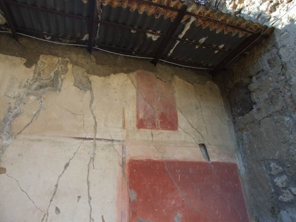 VIII.5.15 Pompeii. March 2009. Room 2, west wall. In a panel near the upper frieze, also with a red background, was Apollo with his lyre standing on a pedestal or perhaps a female figure with a lyre. See NdS, 1882, (p.397)