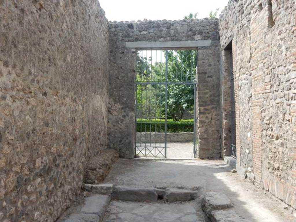 VIII.5.16 Pompeii, ahead, and VIII.5.15 on right. May 2017. Looking towards entrance doorways in small vicolo. Photo courtesy of Buzz Ferebee.