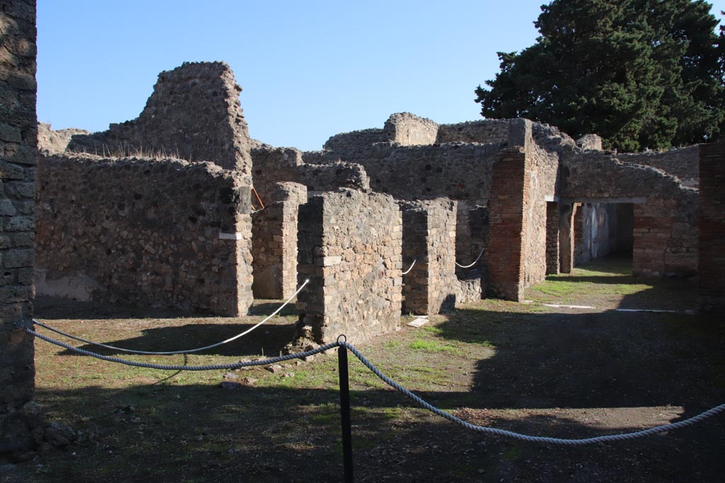 VIII.5.16 Pompeii. October 2022. Looking north-east across portico, with room 1, triclinium, on left. Photo courtesy of Klaus Heese.
