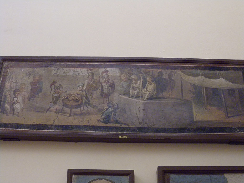 VIII.5.24 Pompeii. Detail from wall painting of Pygmies acting the Judgement of Solomon.  
From a low wall connecting peristyle columns in VIII.5.24.  
Now in Naples Archaeological Museum. Inventory number 113197.