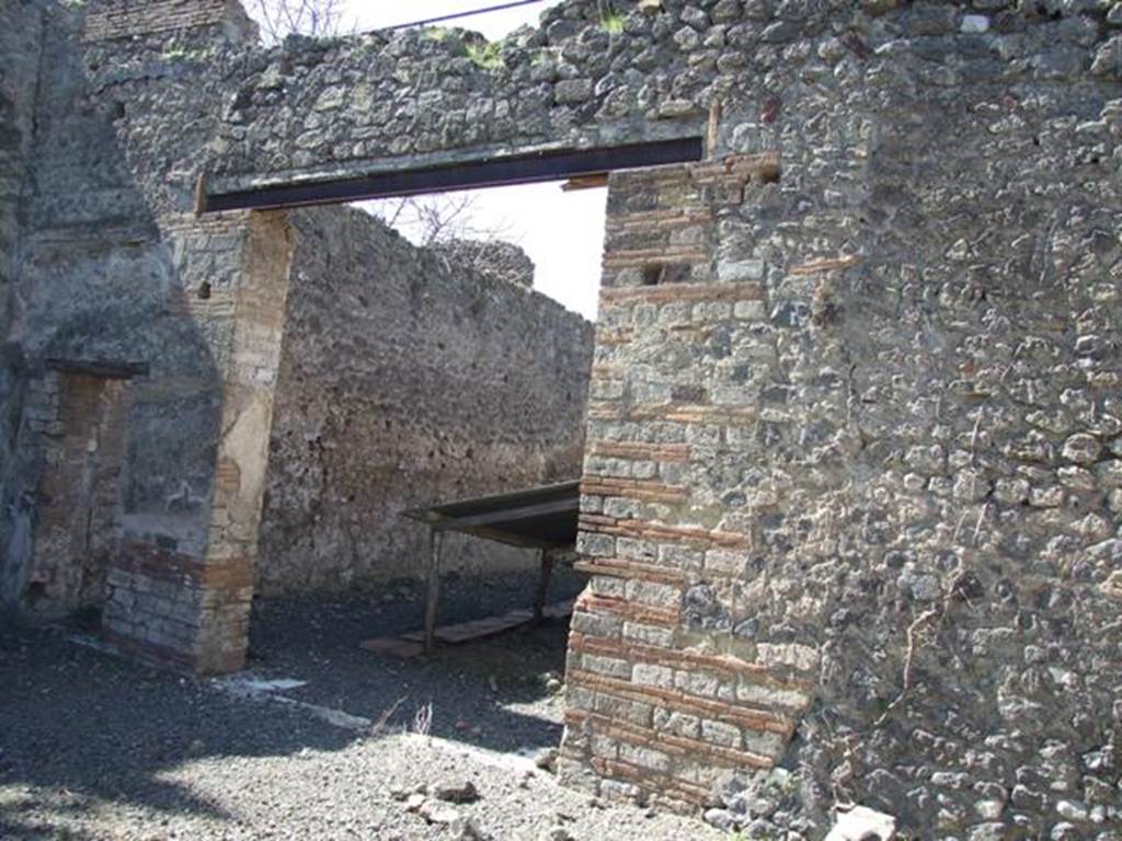 VIII.5.28 Pompeii. March 2009. Doorways to room 11, large triclinium.
According to PPM – in this room -
“Pernice described the only mosaic floor of the house, in black tesserae with a white tesserae border and threshold with an ivy branch made in black on a white background. (III Style).”
See Carratelli, G. P., 1990-2003. Pompei: Pitture e Mosaici.8 (VIII). Roma: Istituto della enciclopedia italiana, (p. 611).
