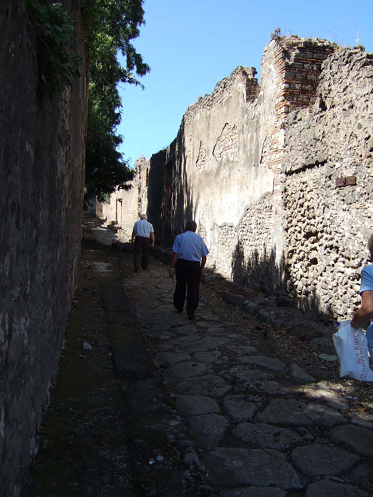 VIII.5.37 Pompeii. September 2005. Wall and possible blocked door, on right.