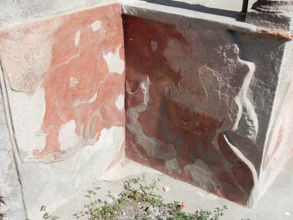 VIII.5.37 Pompeii. May 2017. Room 1, north side of podium of painted lararium with remains of painted plants. Photo courtesy of Buzz Ferebee.