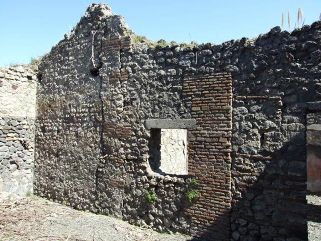 VIII.5.39 Pompeii. March 2009.  Room 6, east wall of small garden area, with window to room 7, and doorway.