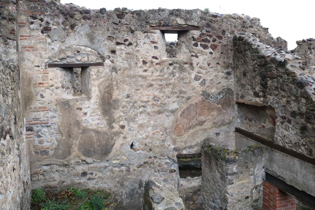 VIII.6.10, Pompeii. December 2018. Looking north in room “u”, stairs to lower floor, in north-west corner of peristyle area, on left.
Room “t”, a cubiculum with recess in the east wall and a small window in the north wall, is on the right (without a floor). 
Photo courtesy of Aude Durand.