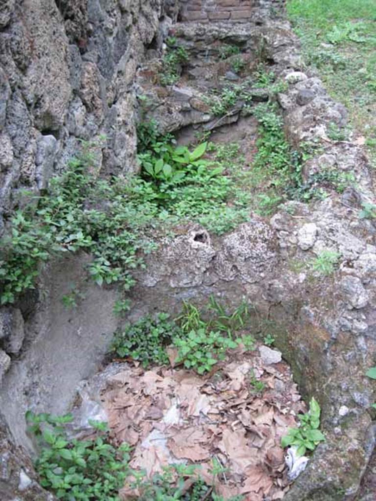 VIII.7.1 Pompeii. September 2010. Feature on north wall of entrance room. 
Three rectilinear basins or watering troughs for horses? Photo courtesy of Drew Baker.