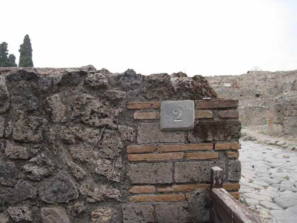 VIII.7.2 Pompeii. September 2010. House number plate on north wall at entrance. Photo courtesy of Drew Baker.