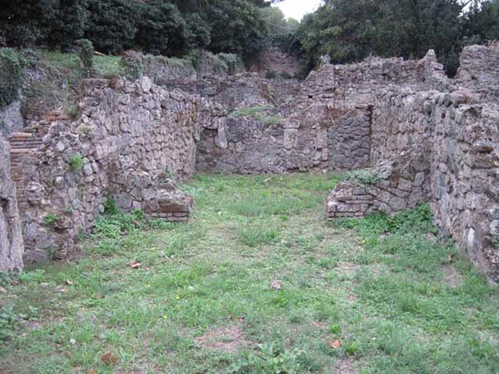 VIII.7.3 Pompeii. September 2010. Looking west across shop towards rear room, from entrance.  Photo courtesy of Drew Baker.