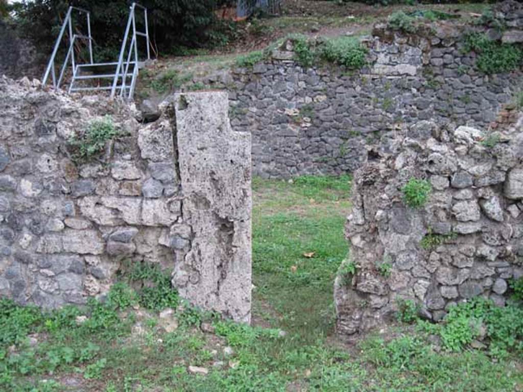VIII.7.3 Pompeii. September 2010. Looking south towards city wall through doorway in south wall, leading to the under stairs area of VIII.7.2, and VIII.7.1. Photo courtesy of Drew Baker.