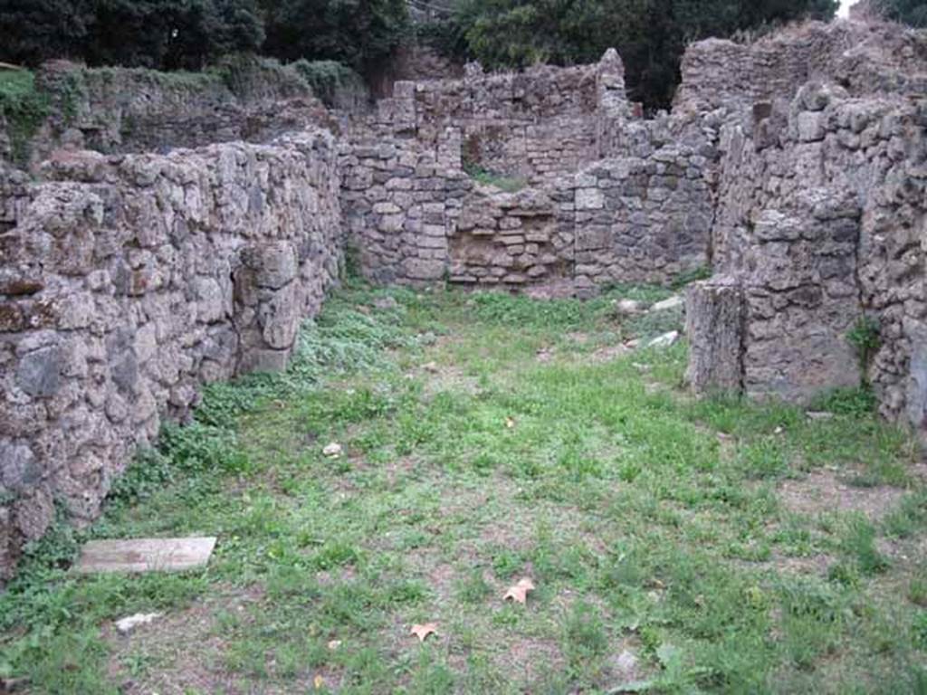 VIII.7.4 Pompeii. September 2010. Entrance on Via Stabiana. Looking west (from entrance) across shop and rear room. Photo courtesy of Drew Baker.