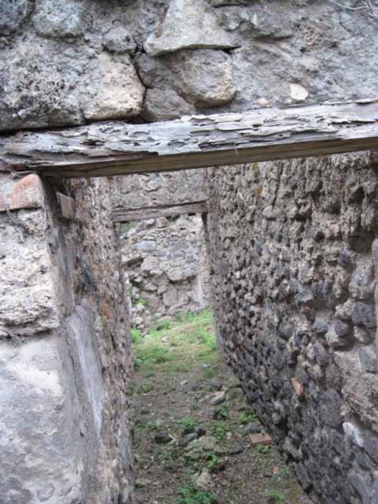 VIII.7.6 Pompeii. September 2010. Corridor leading to kitchen area, on south side of main corridor leading west. Photo courtesy of Drew Baker.