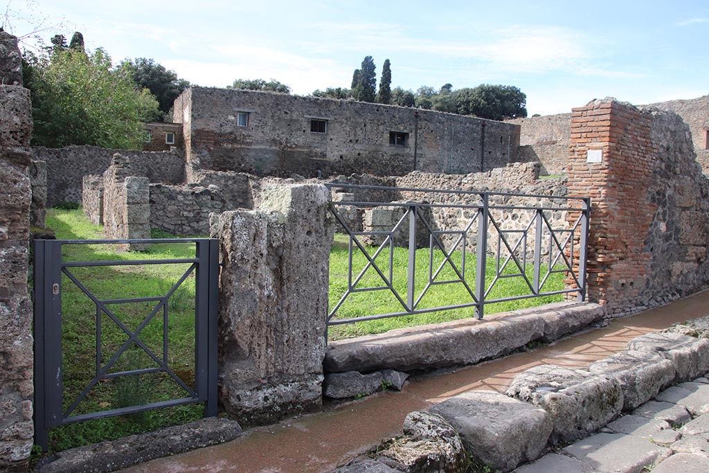 VIII.7.7 Pompeii, on left, and VIII.7.8. October 2024. 
Looking north-west to entrance doorways on Via Stabiana. Photo courtesy of Klaus Heese.