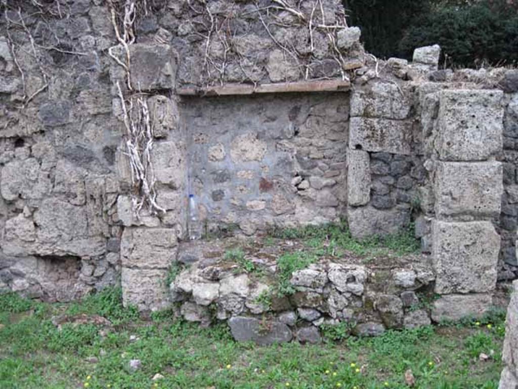 VIII.7.8 Pompeii. September 2010. Looking south at kitchen with bench, near south wall of shop. Photo courtesy of Drew Baker.
