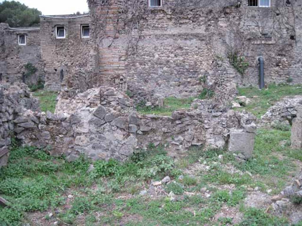 VIII.7.11 Pompeii. September 2010. 
West wall of triclinium and doorway in north-west corner to corridor. Photo courtesy of Drew Baker.