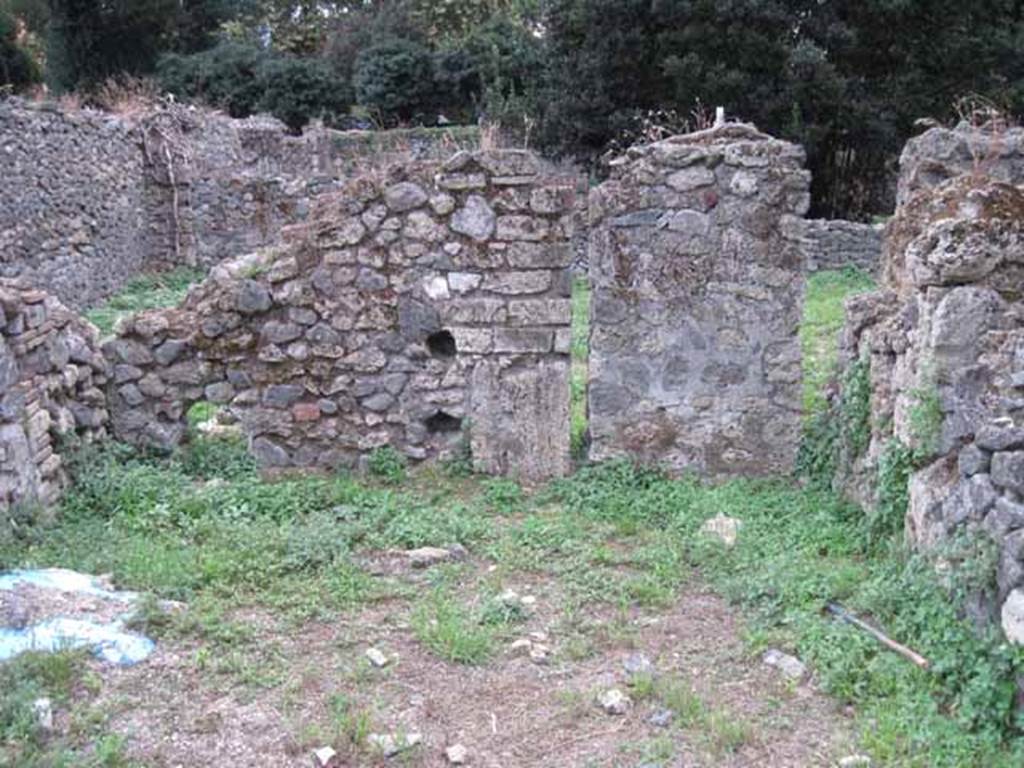 VIII.7.11 Pompeii. September 2010. Garden area, looking south towards blocked doorway to garden of VIII.7.10. Photo courtesy of Drew Baker.