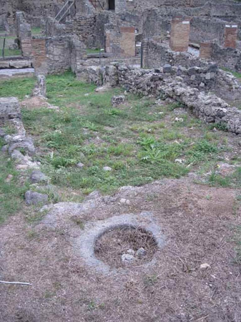 VIII.7.14 Pompeii. September 2010. Detail of cistern mouth in rear garden or yard. Looking east to road. Photo courtesy of Drew Baker.