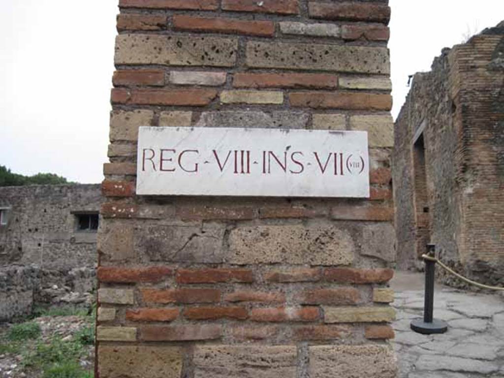 VIII.7.15 Pompeii. September 2010. ID Plate on north pilaster, between VIII.7.15 and VIII.7.16. Photo courtesy of Drew Baker.