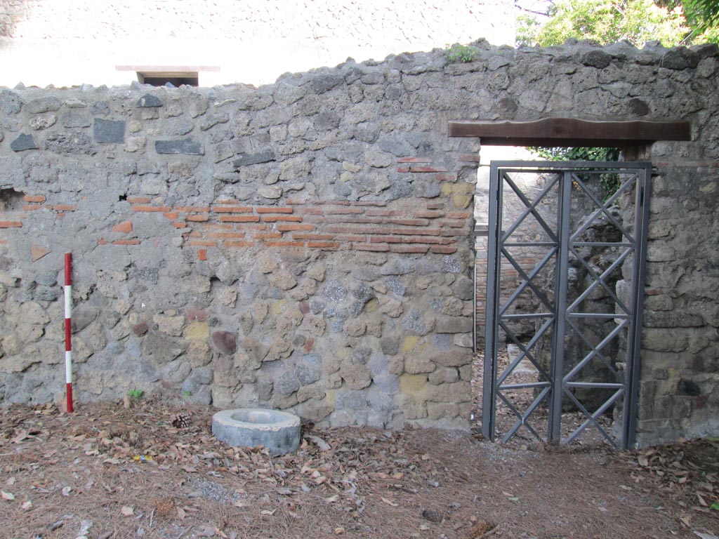 VIII.7.16 Pompeii. July 2012. 
Looking north towards exterior of entrance doorway in south-east corner. Photo courtesy of Eric Poehler.