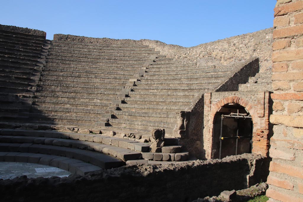 VIII.7.18 Pompeii. October 2023. Looking north-east across stage towards east side of Little Theatre. Photo courtesy of Klaus Heese.