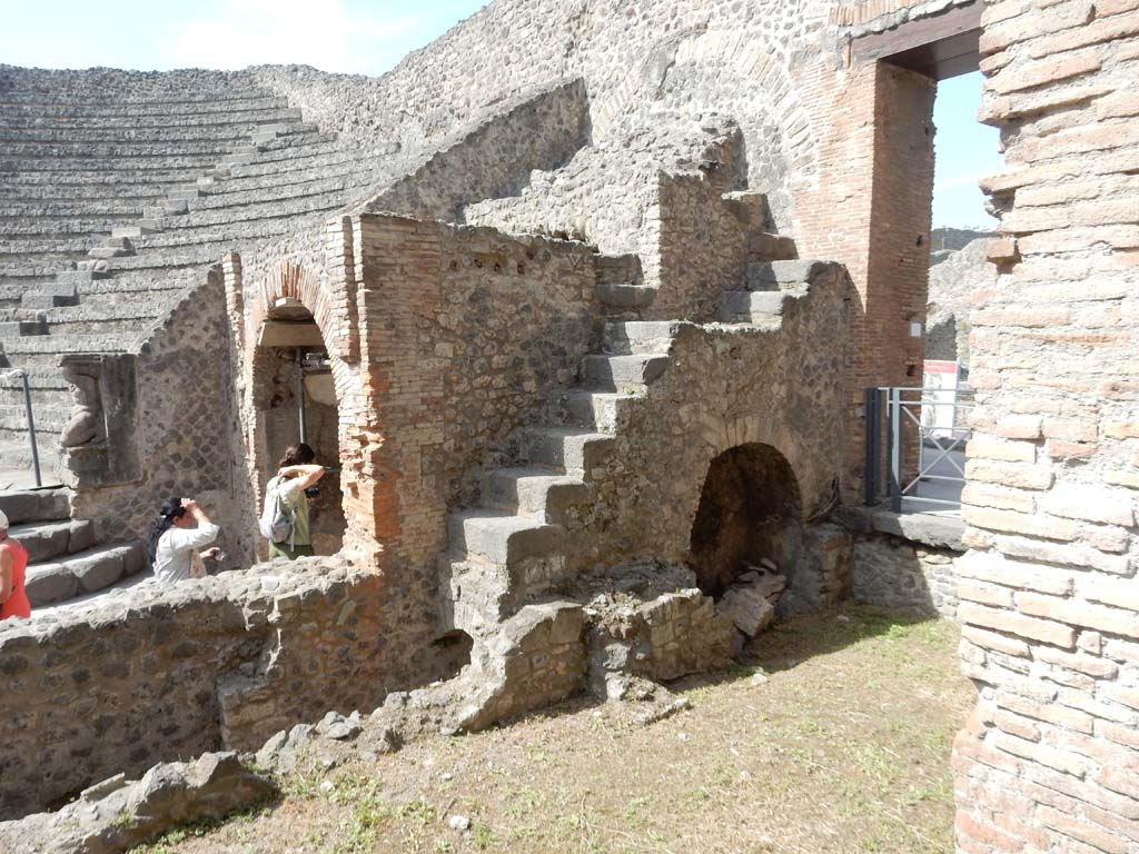 VIII.7.19 Pompeii. June 2019. 
Small narrow steps leading to seating for the honoured guests, looking towards east side of Little Theatre. 
Photo courtesy of Buzz Ferebee.