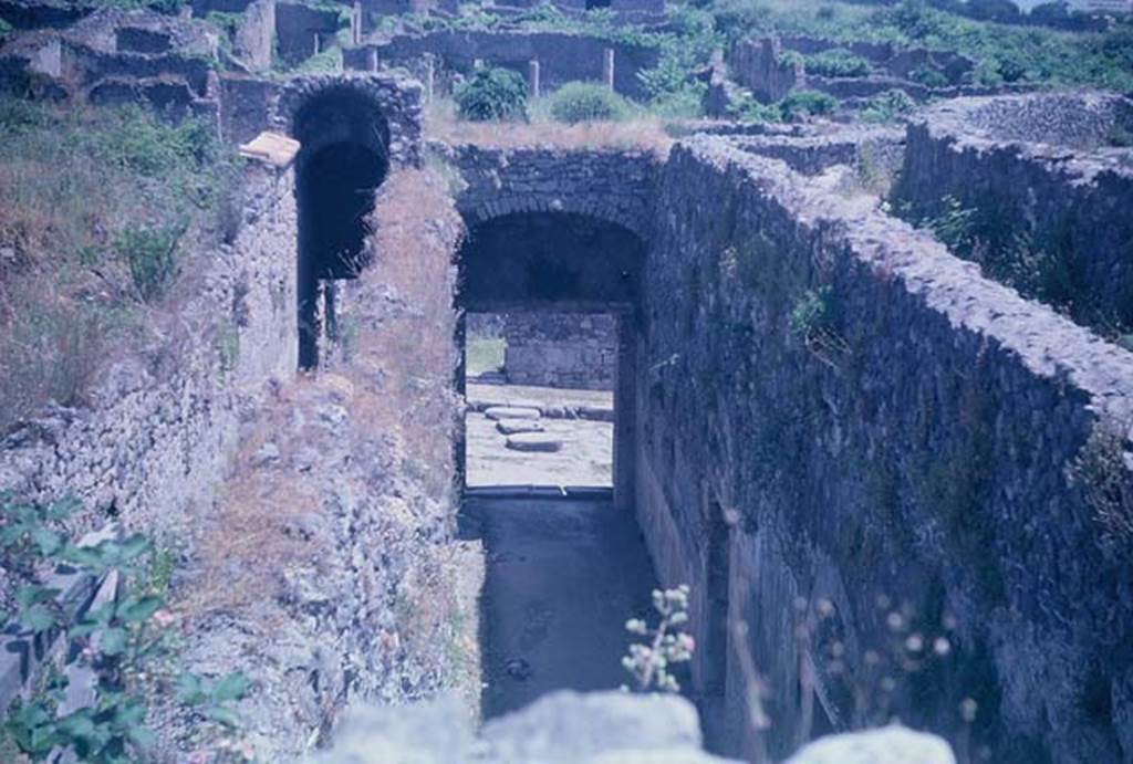 VIII.7.21 Pompeii (on left) and VIII.7.20 (centre). June 1962. 
Looking east from entrance corridors towards Reg. 1, insula 3. Photo courtesy of Rick Bauer.
