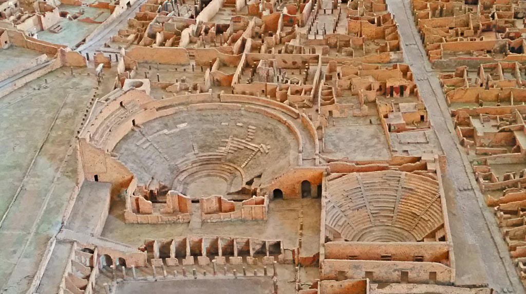 VIII.7.20 Pompeii. 2016/2017. 
Detail of Large Theatre, Little Theatre and other areas of VIII.7, from model in Naples Archaeological Museum. 
Photo courtesy of Giuseppe Ciaramella 
This entrance also provided access to the two rear entrances to the Little Theatre or Odeon.
For more details of the Large Theatre:
See Mau, A., 1907, translated by Kelsey F. W. Pompeii: Its Life and Art. New York: Macmillan. pages 141-152.