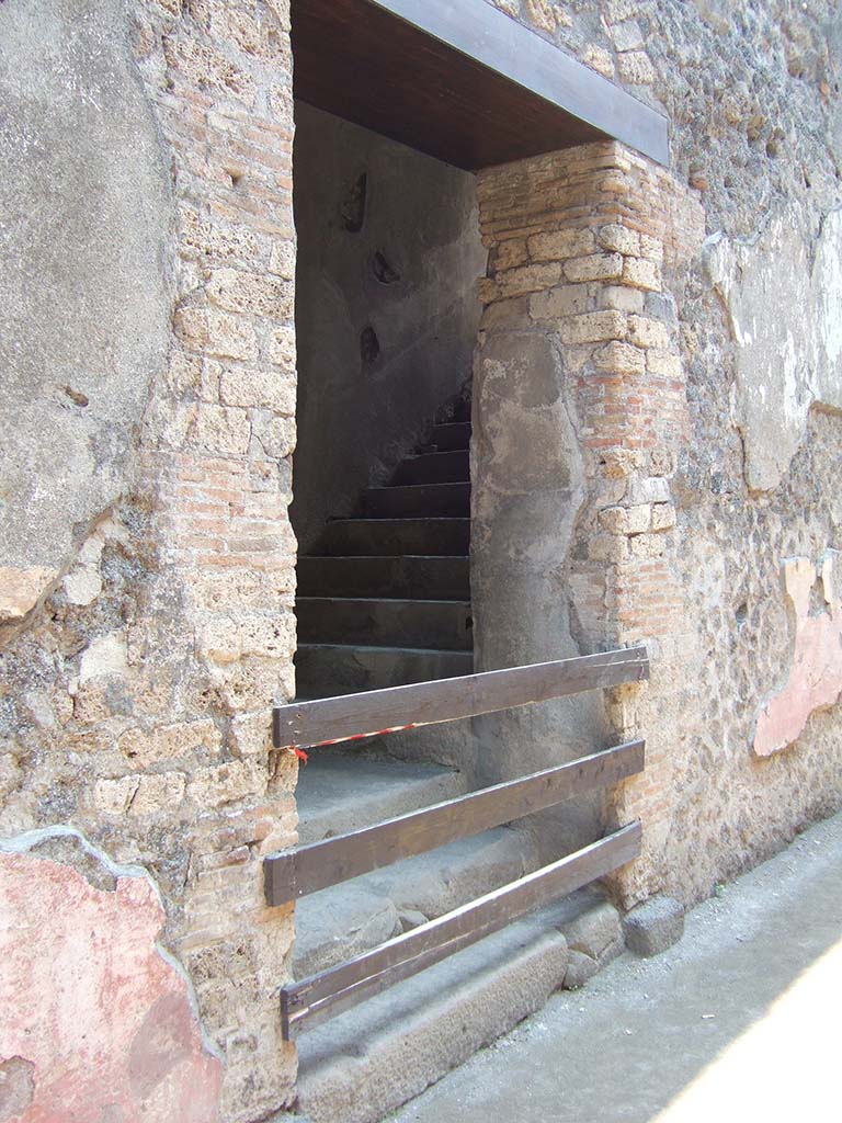 VIII.7.20 Pompeii. May 2006. South wall. 
First, east rear entrance to the Little Theatre or Odeon with steps to upper seating.