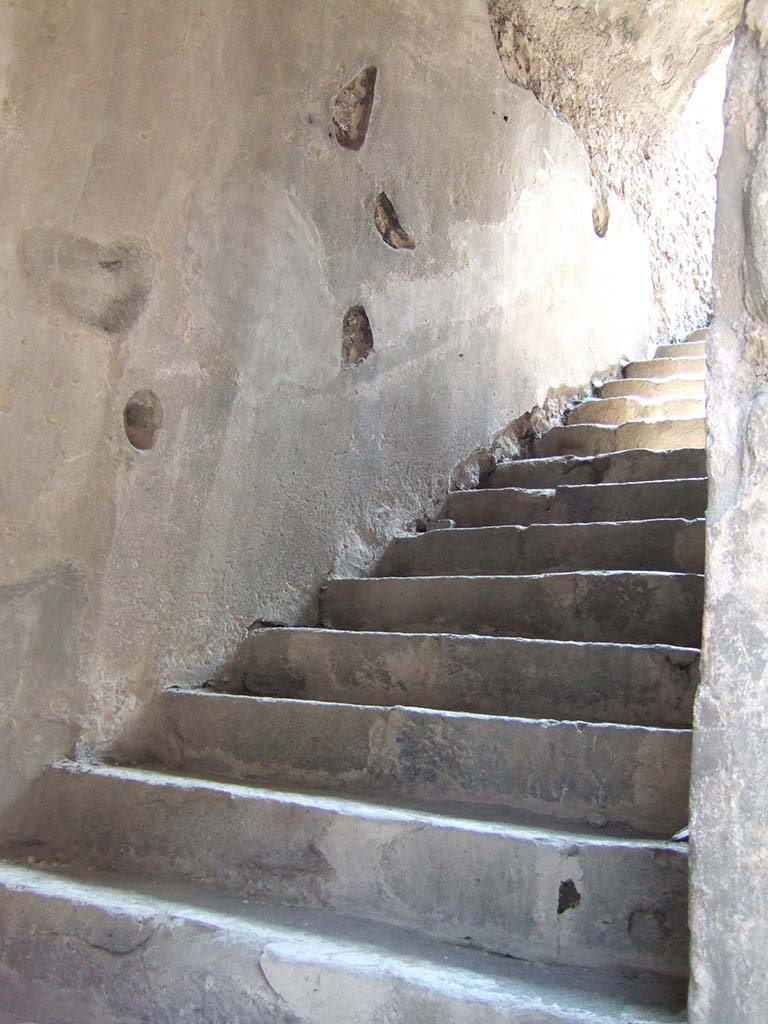 VIII.7.20 Pompeii. May 2006. 
First, east rear entrance to the Little Theatre or Odeon with steps to upper seating.