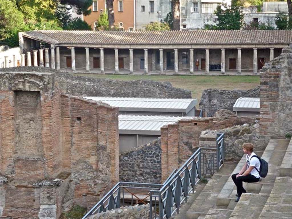 8.7.20 Pompeii. September 2011. Large Theatre, looking south to Gladiator’s Barracks. 
Photo courtesy of Michael Binns.
