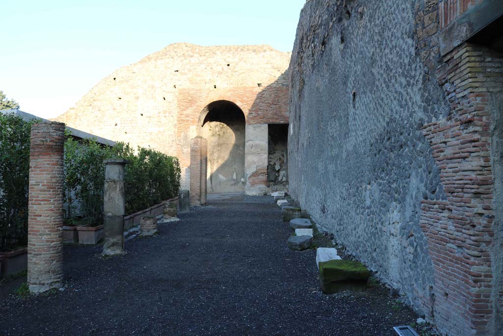 VIII.7.20 Pompeii. December 2018. 
East side. Looking north in area behind the stage, with entrance to Little Theatre, on right. Photo courtesy of Aude Durand.
