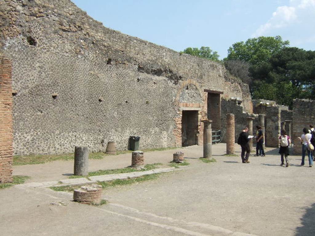 VIII.7.20 Pompeii. May 2006. East side. Looking south past the area behind the stage, towards the doorway to the Little Theatre.