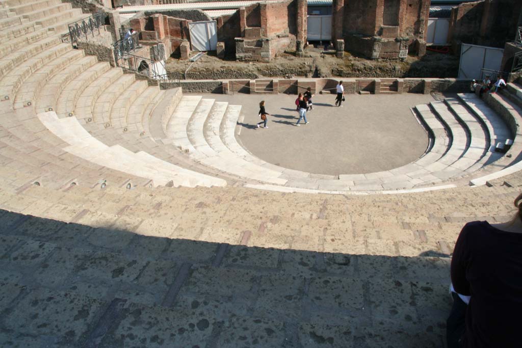 VIII.7.21 Pompeii. April 2011. Looking south from top of theatre, towards seating and stage area.
Photo courtesy of Klaus Heese.