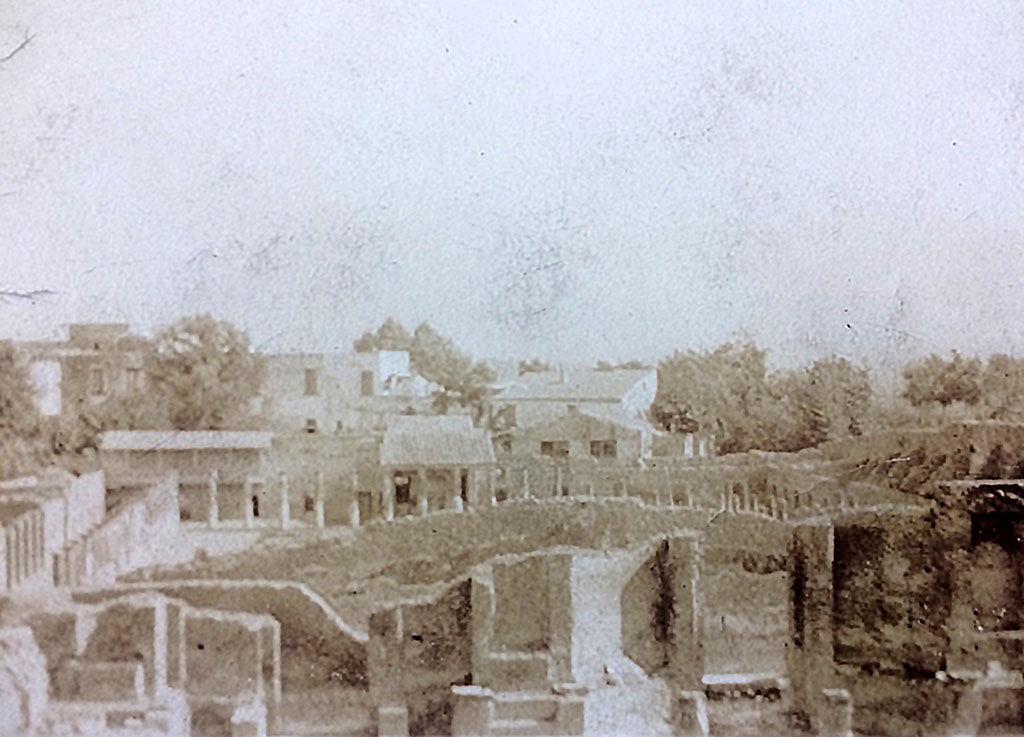 VIII.7.21 Pompeii. 1920s. 
Looking south towards stage and Gladiator’s Barracks from top of Large Theatre. Photo courtesy of Rick Bauer.