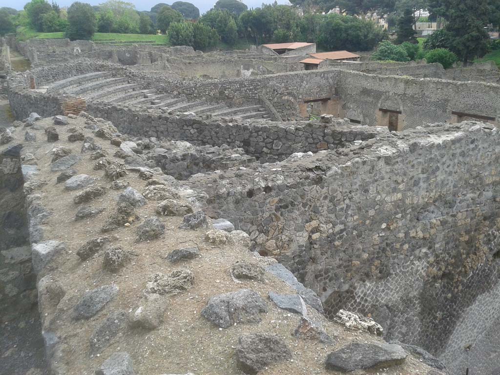 VIII.7.21 Pompeii. April 2014. Looking south-east from top of Theatre, across the top of the Small Theatre/Odeon.
Photo courtesy of Klaus Heese.